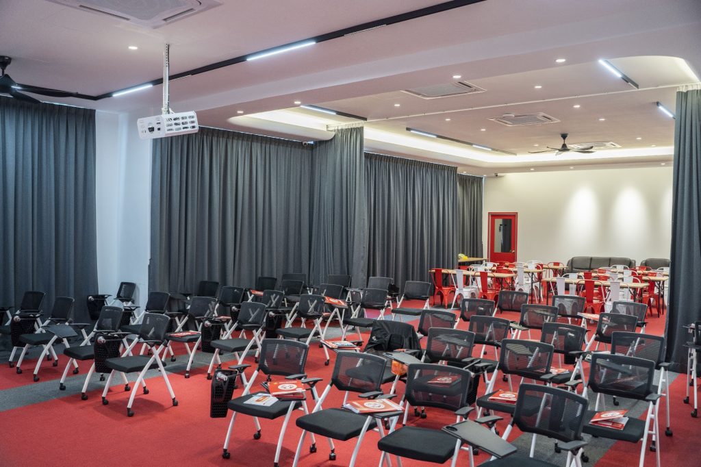 Empire Room with projector and tablet-arm chairs for training and events