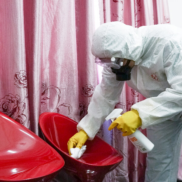 Wiping high-contact surfaces with disinfectant
